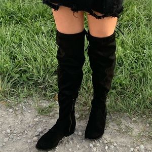 A New Day high legged black boots comes in sizes 8 and 8 1/2.